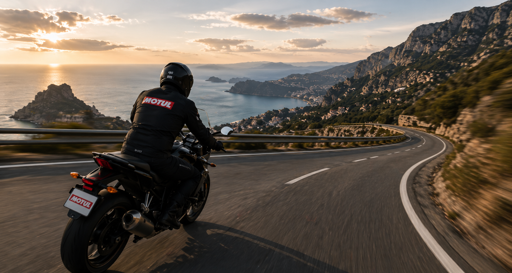 Motorcyclist riding on a scenic coastal road representing the Motul Ride partner ecosystem